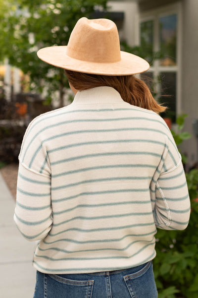 Back view of a sage sweater