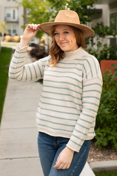 Sage sweater with rolled hem on cuffs