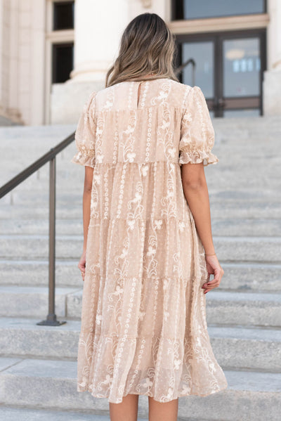 Back view of the beige embroidered dress