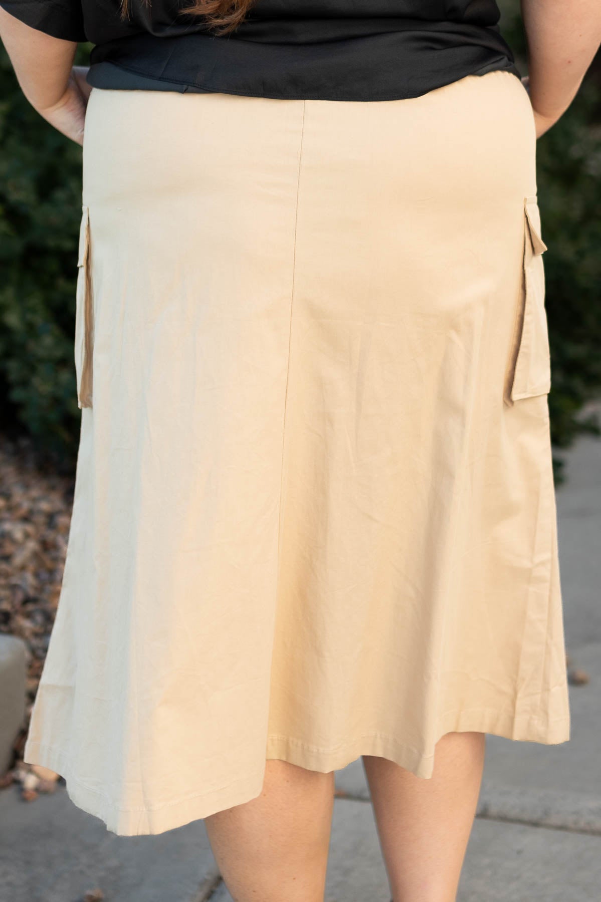 Back view of a plus size beige skirt