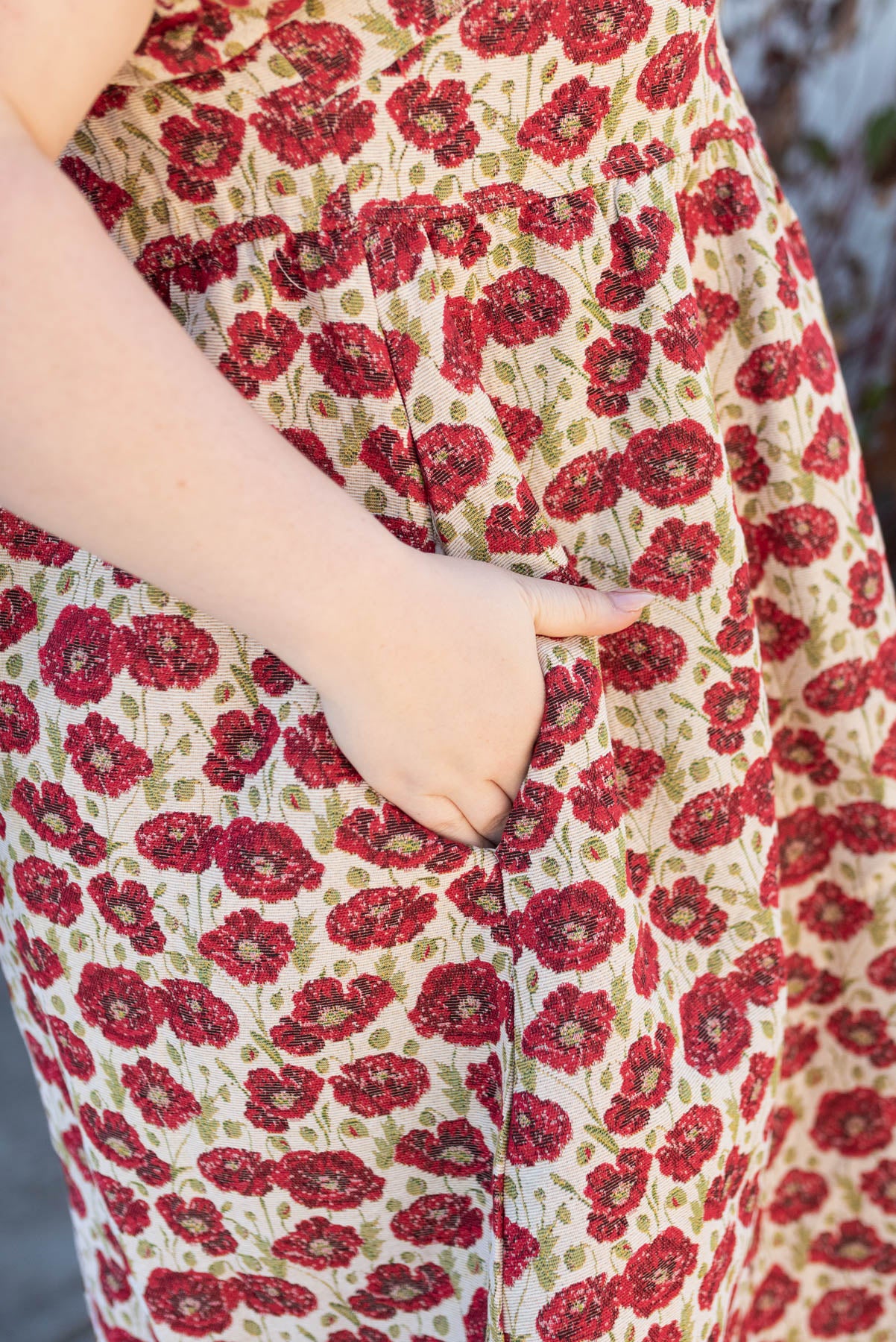 Close up of the fabric on the plus size red floral dress