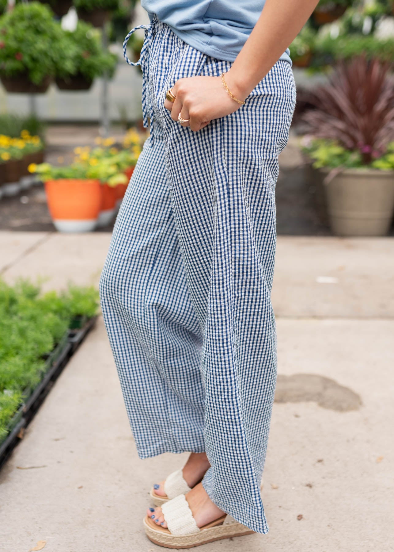 Side view of the blue gingham pants