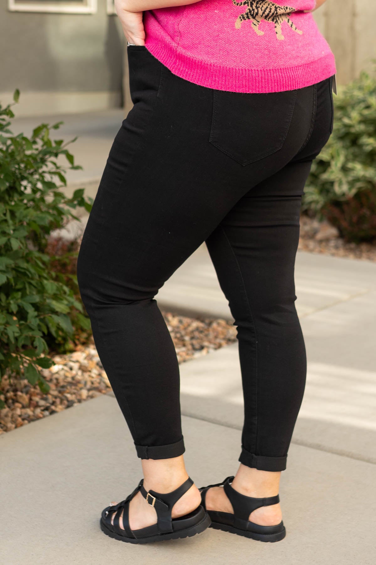 Side view of plus size black jeans