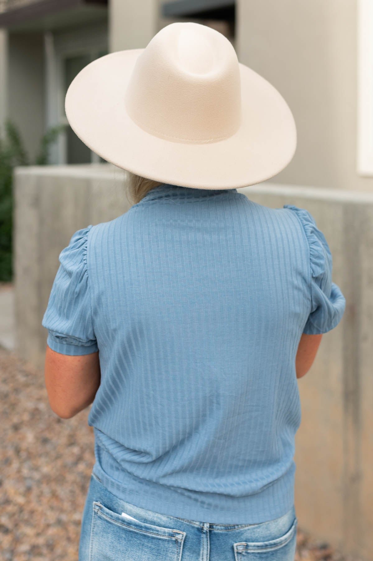 Back view of a blue ribbed top