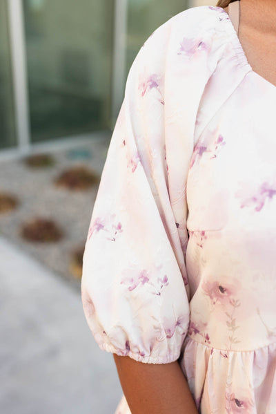 Close up of the sleeve and fabric on  the lavender blush floral dress