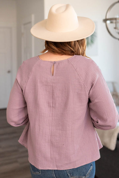 Back view of a mauve blouse