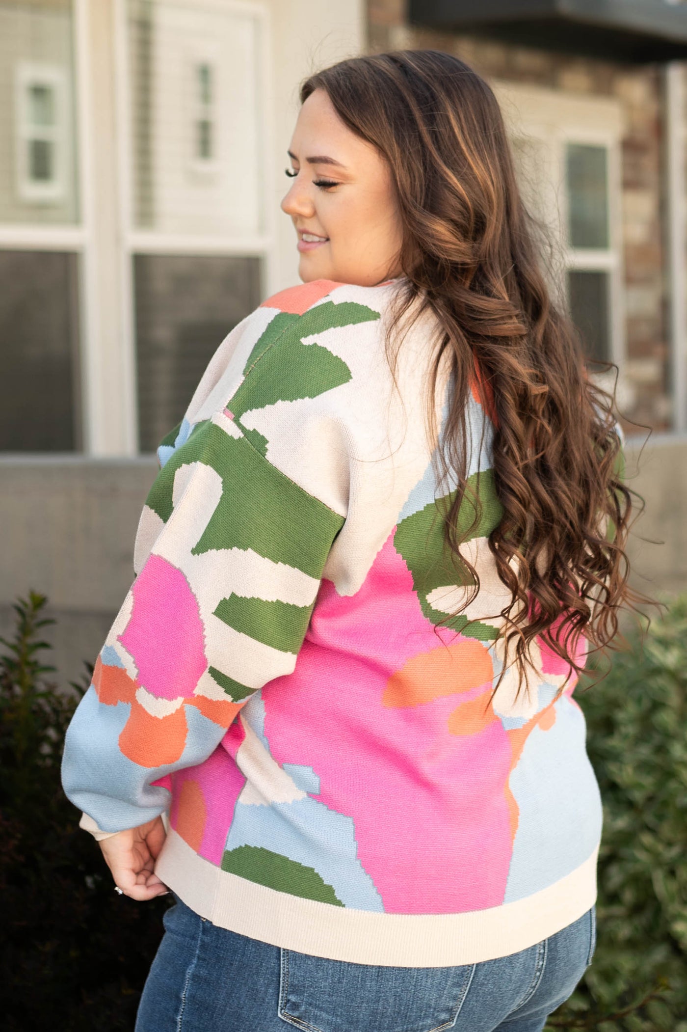Side view of a plus size multi sweater
