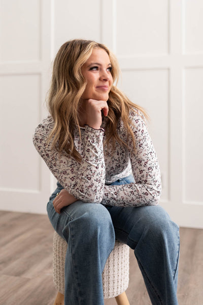 Small flowers on a burgundy flower print long sleeve top