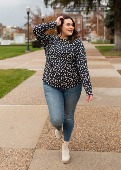Navy flower print long sleeve top with white flowers