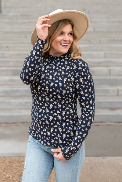 Navy flower print long sleeve top with navy ruffle stitching  on the edges