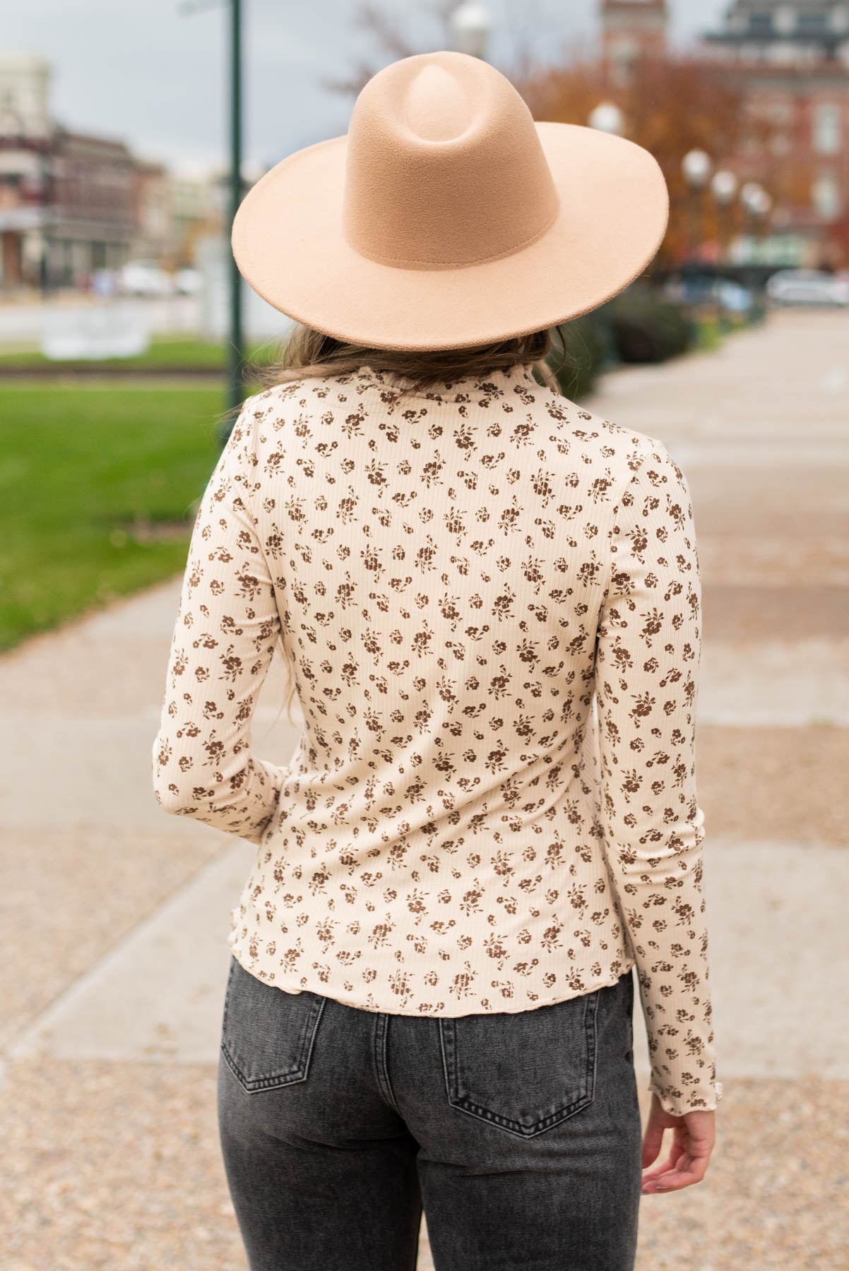 Back view of the sand flower print long sleeve top