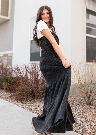 Side view of the black cotton overall dress