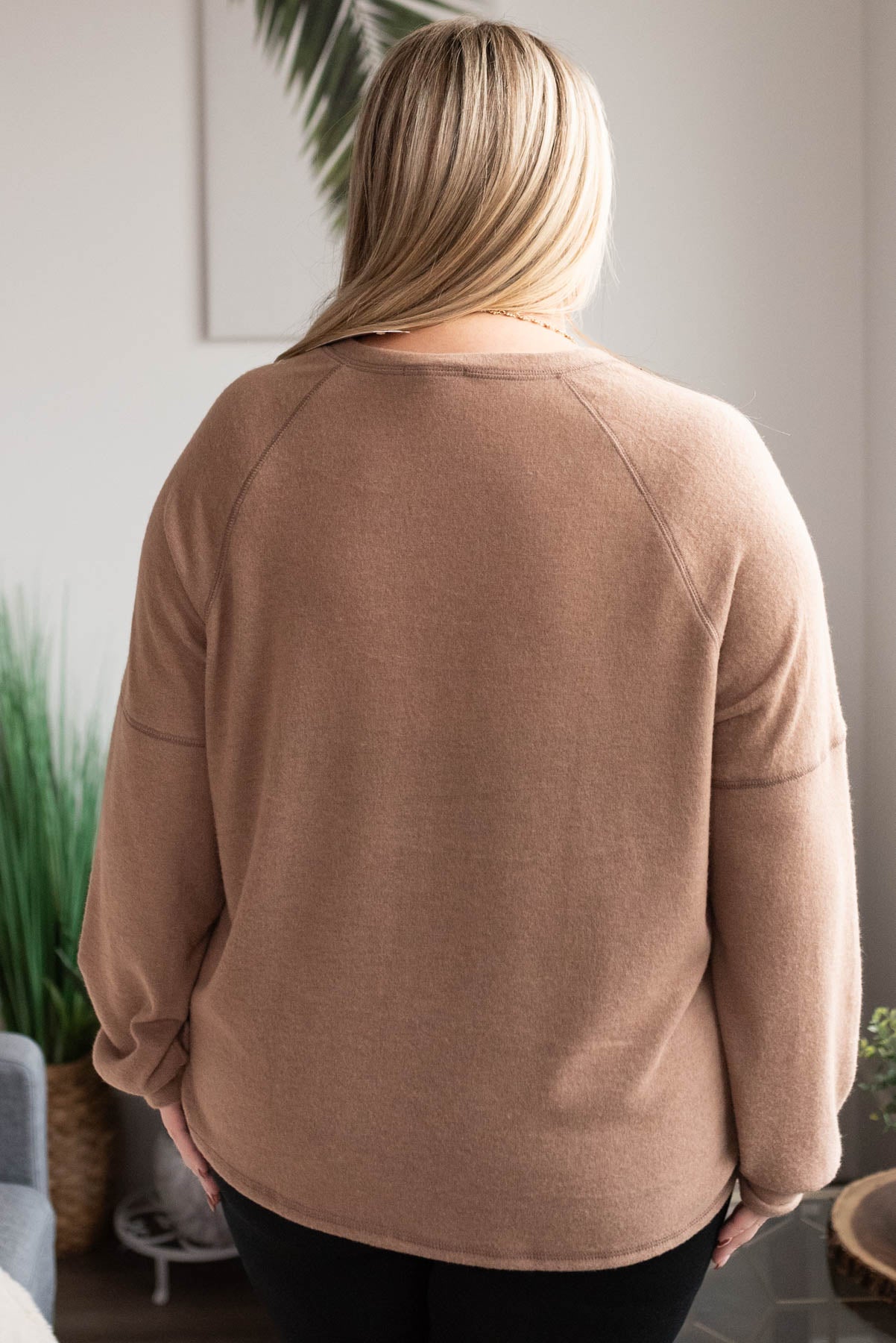 Back view of the plus size mocha button top