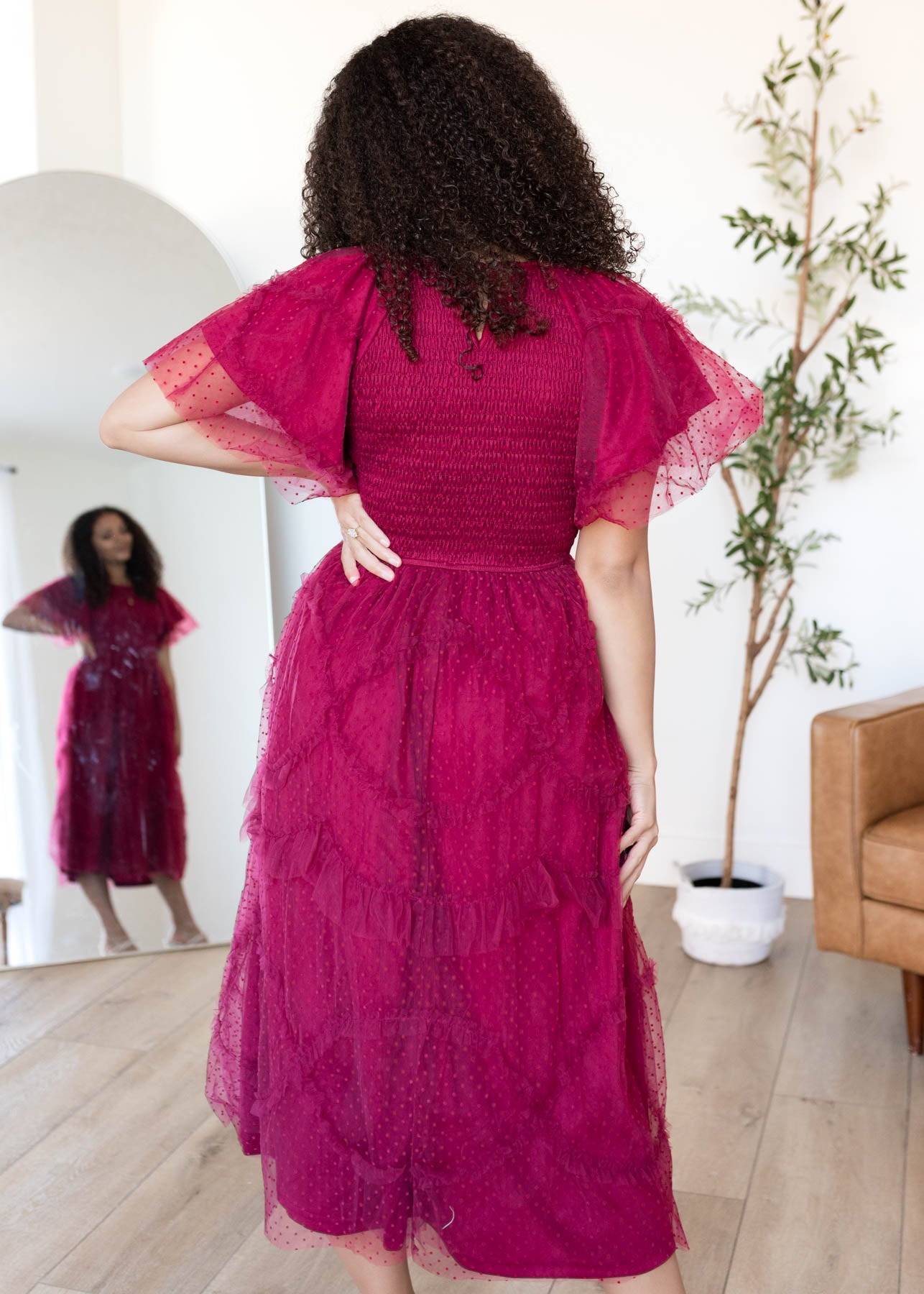Back view of the burgundy smocked ruffle dress