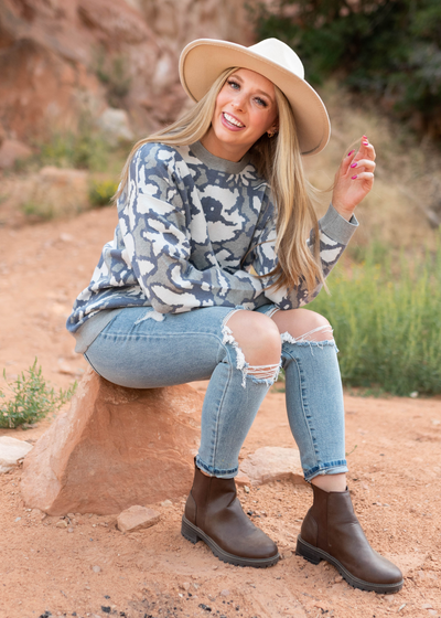 Grey sweater with a floral print
