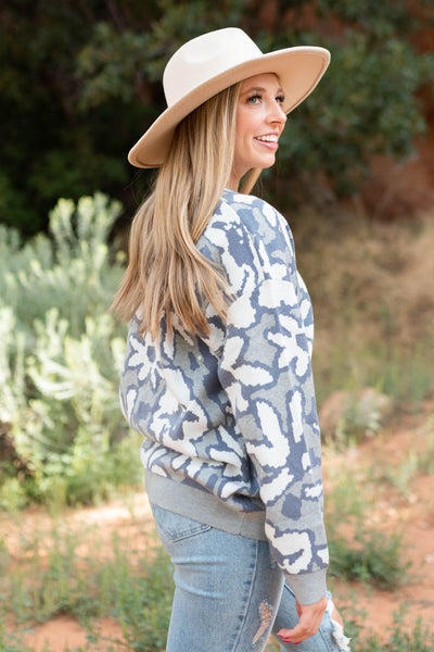 Side view of a grey sweater