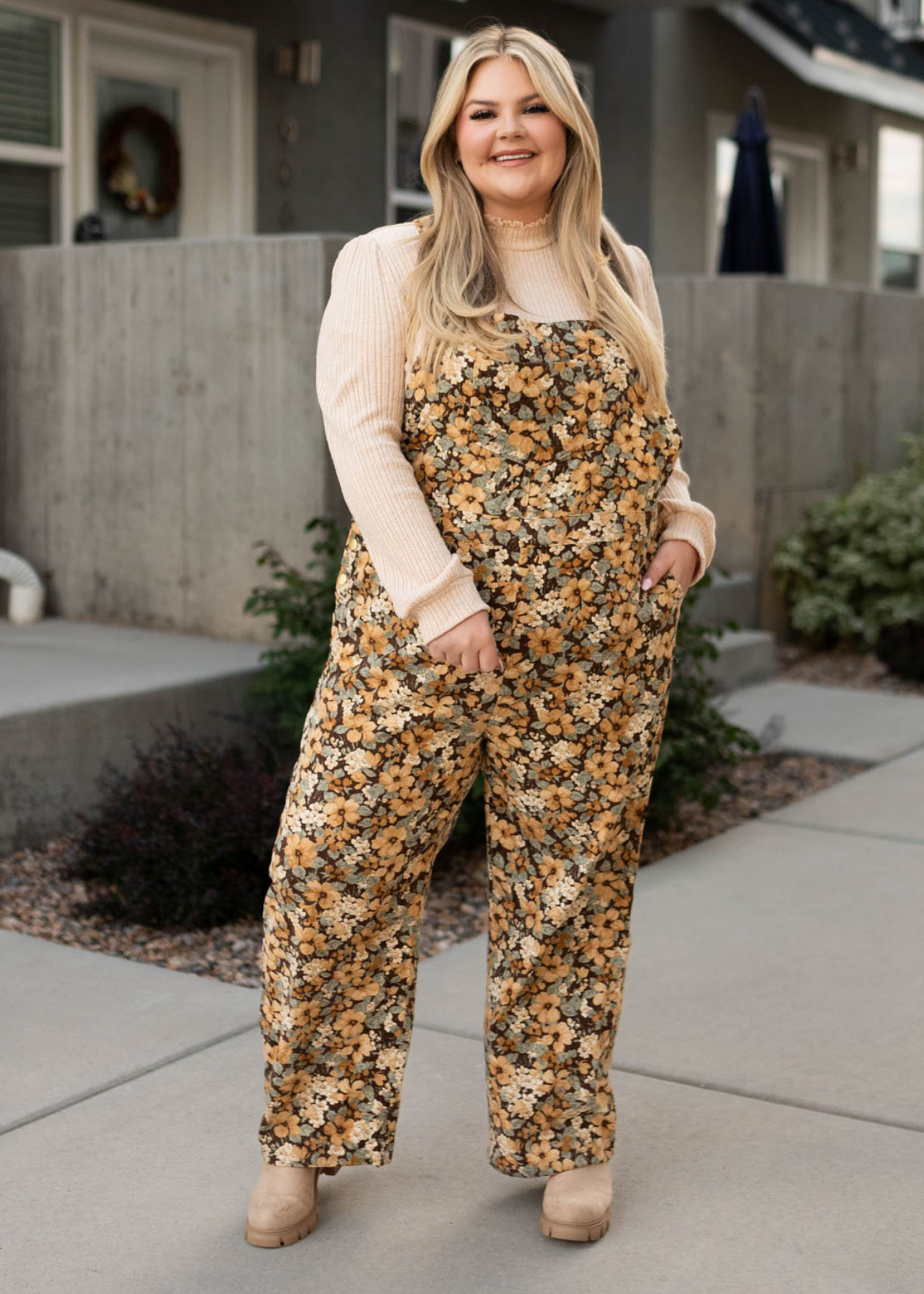 Front view of plus size floral corduroy overalls