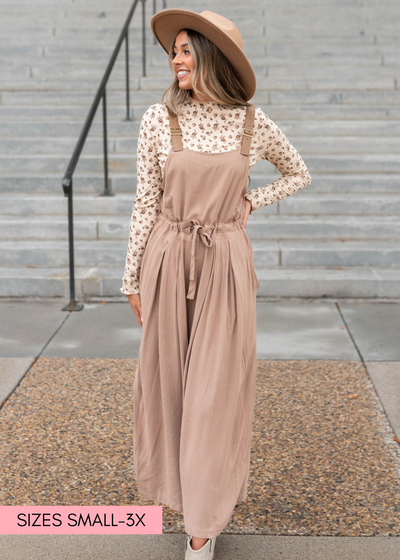 Small mocha jumpsuit that ties at the waist and has pockets