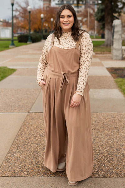 Plus size mocha jumpsuit with pleats at the waist