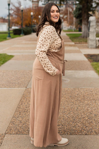 Side view of a plus size mocha jumpsuit