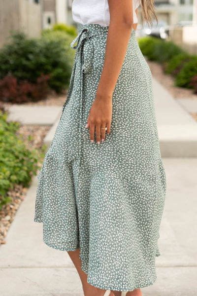 Side view of a green wrap skirt