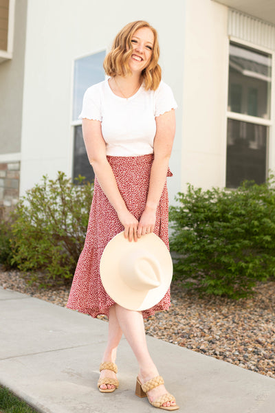 Red high low skirt with small white flowers