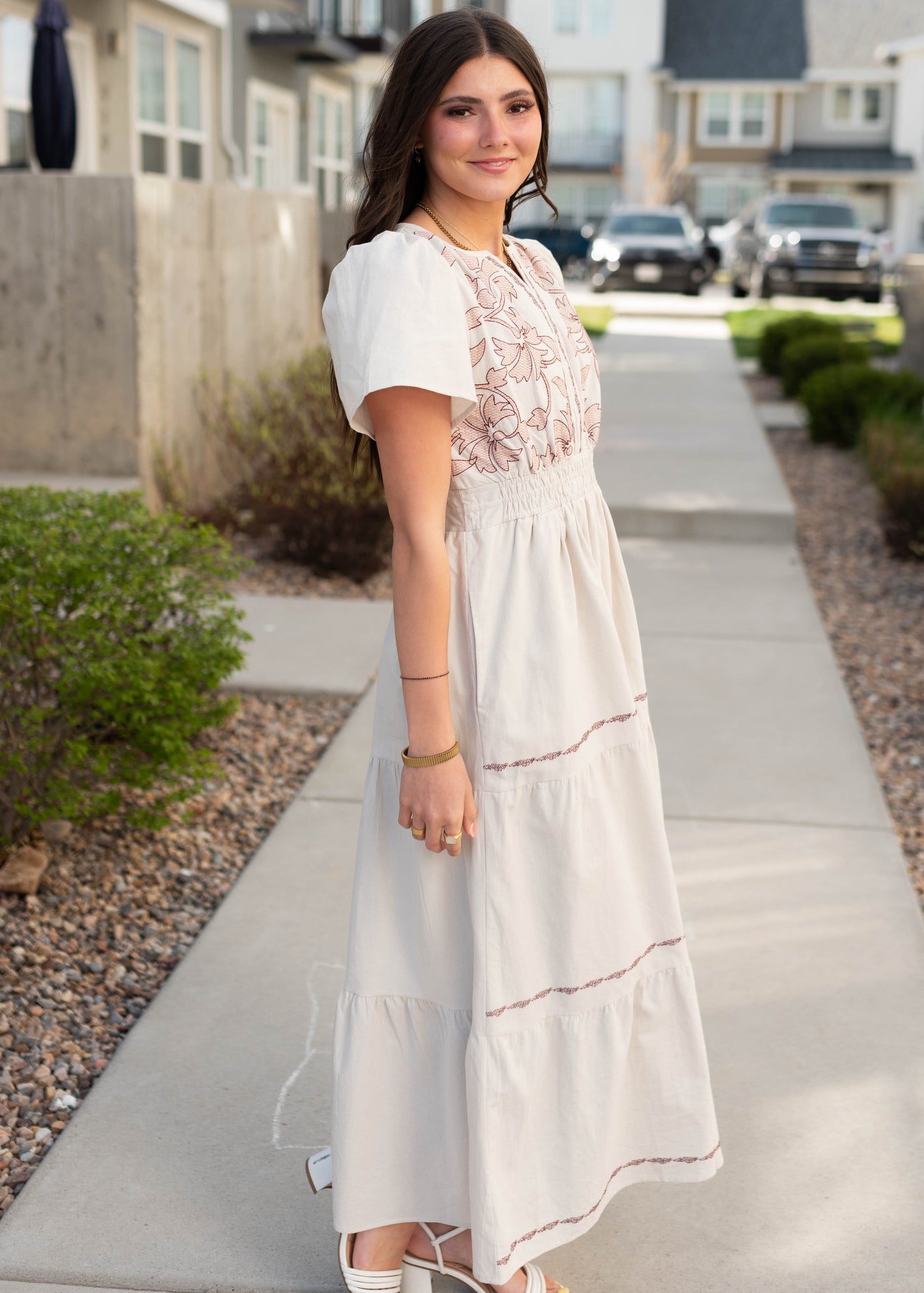 Side view of the natural embroidered dress