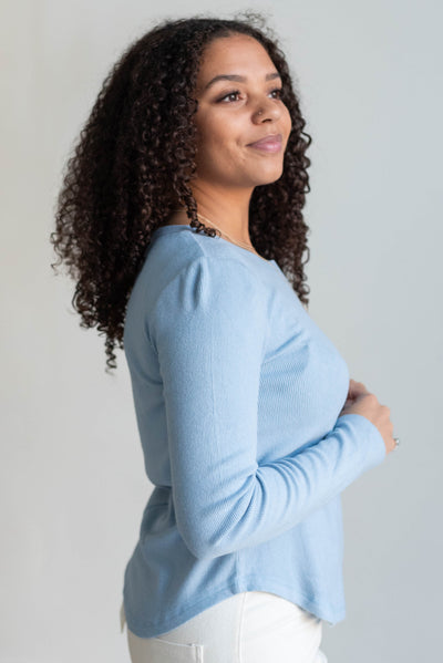 Side view of the sky blue long sleeve top