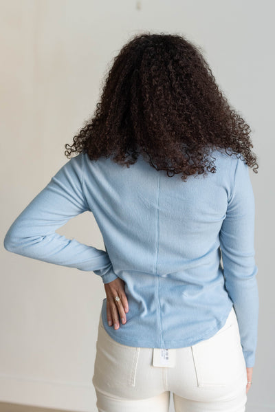 Back view of the sky blue long sleeve top