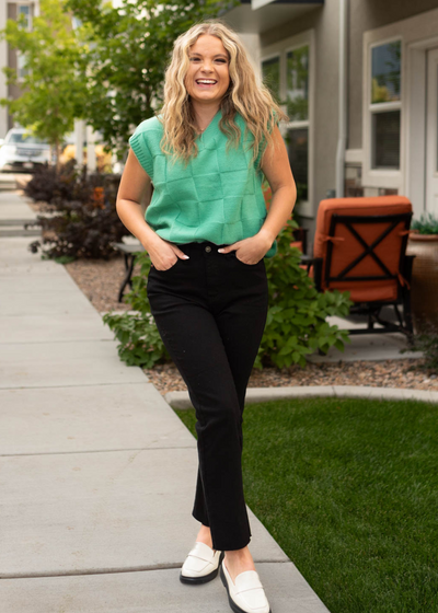 Green sweater vest with a v-neck