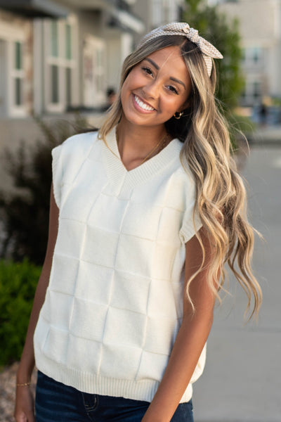 Ivory sweater with a v-neck