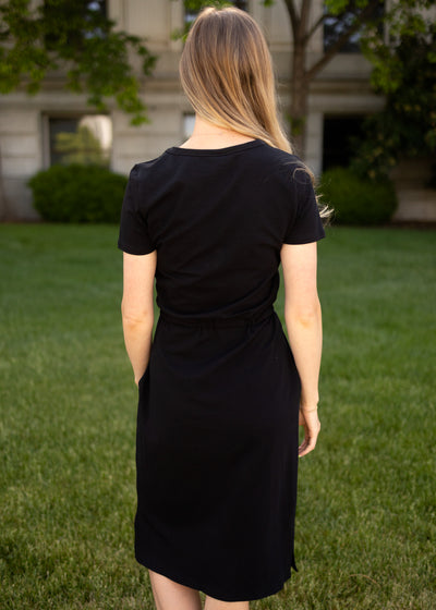 Back view of an knit black dress