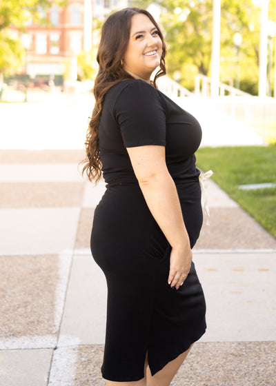 Side view of a knit black dress