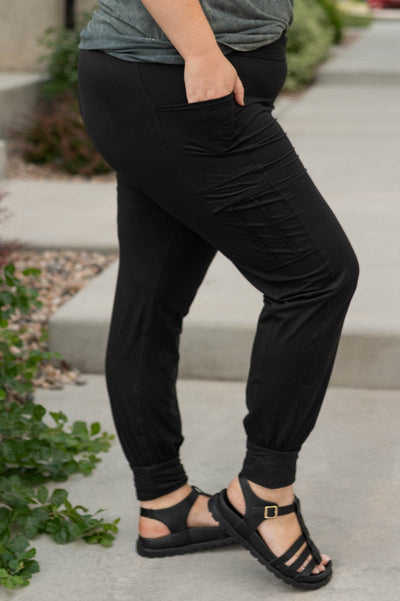 Side view of plus size black joggers