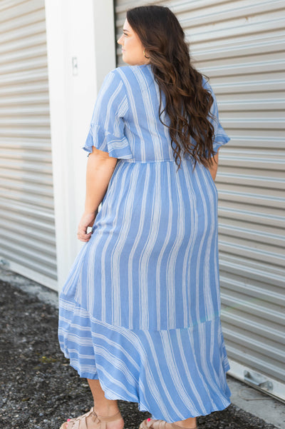 Side view of a blue stripe plus size wrap dress