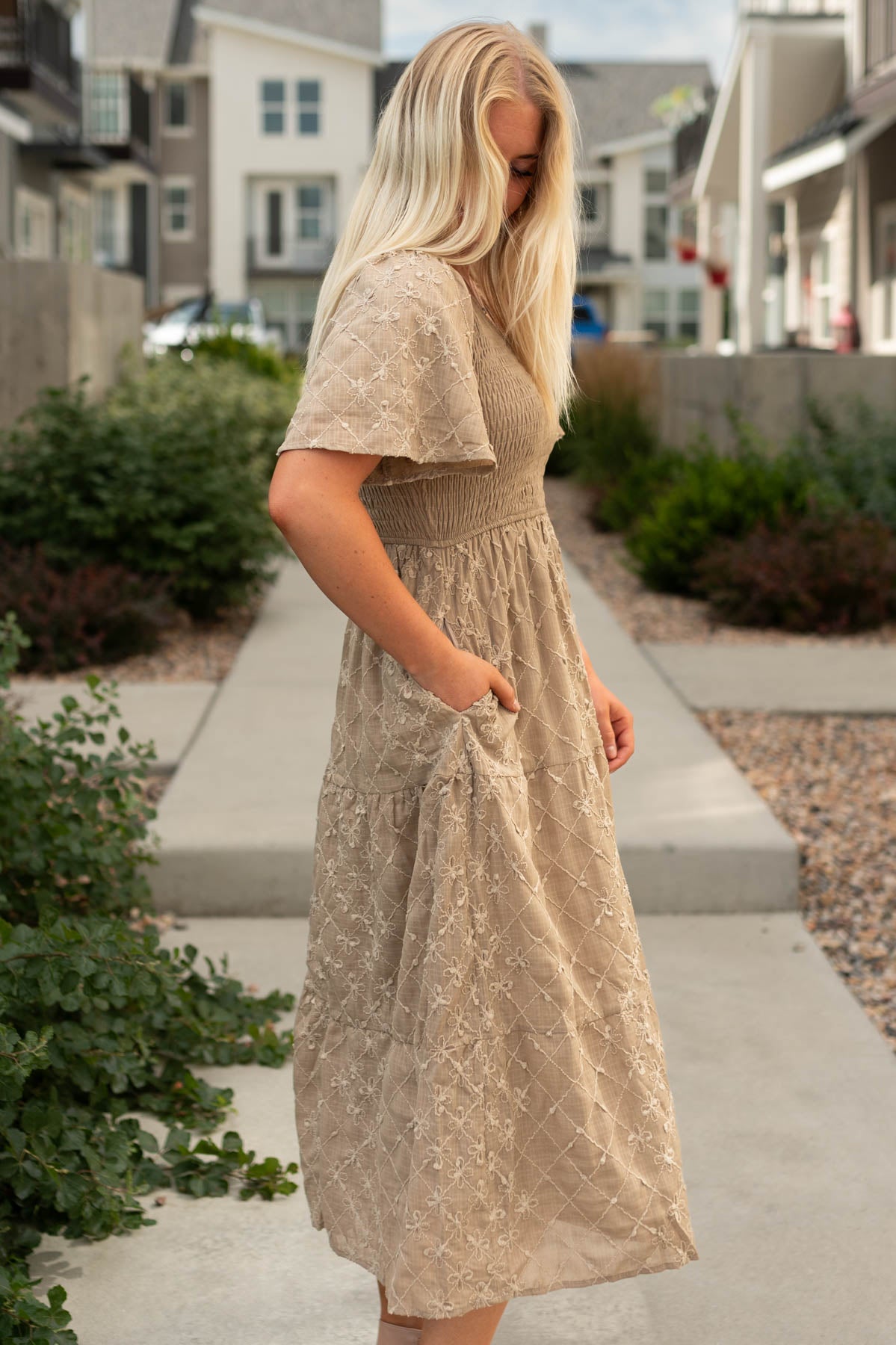 Side view of a taupe dress