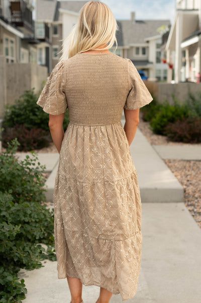 Back view of a taupe dress