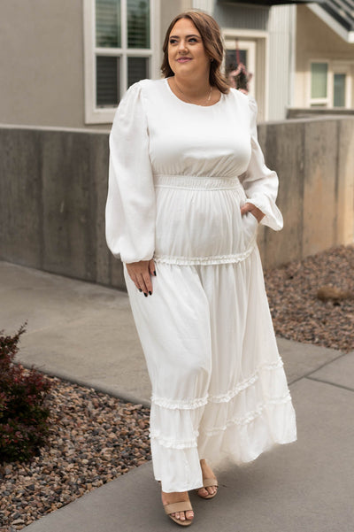 Long sleeve plus size Chelsea white dress with tiered skirt and elastic waist