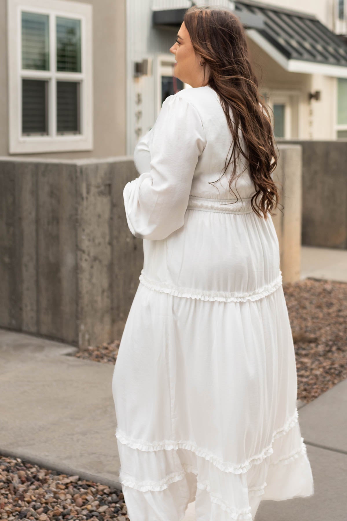 Side view of a plus size Chelsea white dress