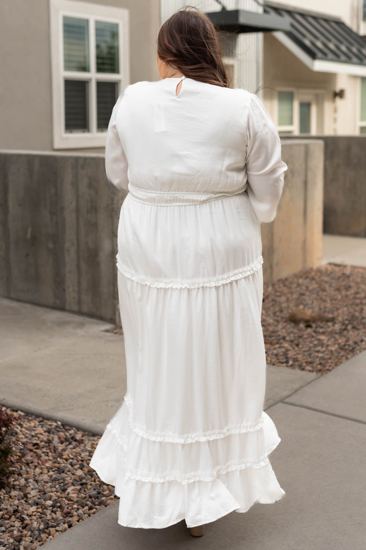 Back view of a plus size Chelsea white dress