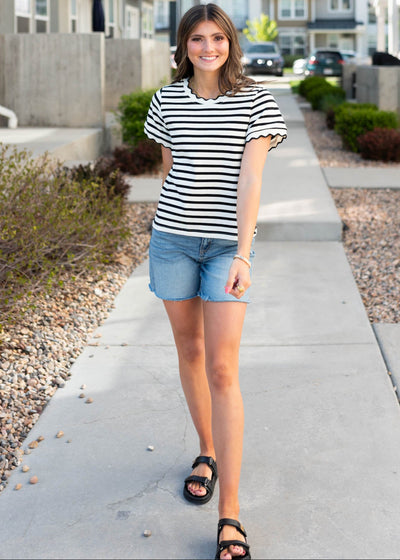 Black stirped top with scalloped neck and cuffs