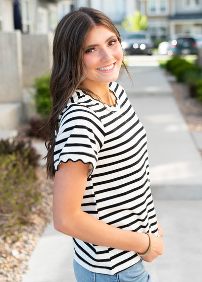 Side view of the black striped top