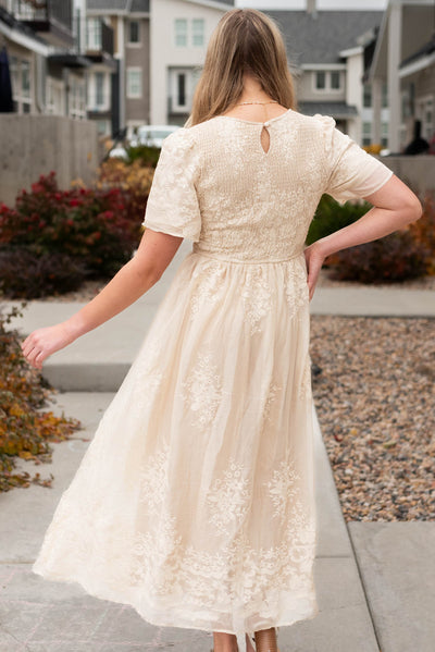 Back view of the champagne embroidered dress