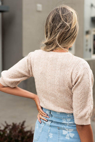 Back view of a taupe top