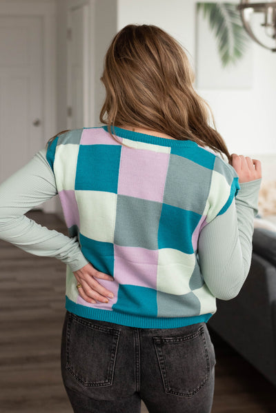 Back view of the teal checkered sweater vest