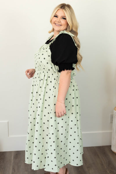 Side view of a plus size mint dress