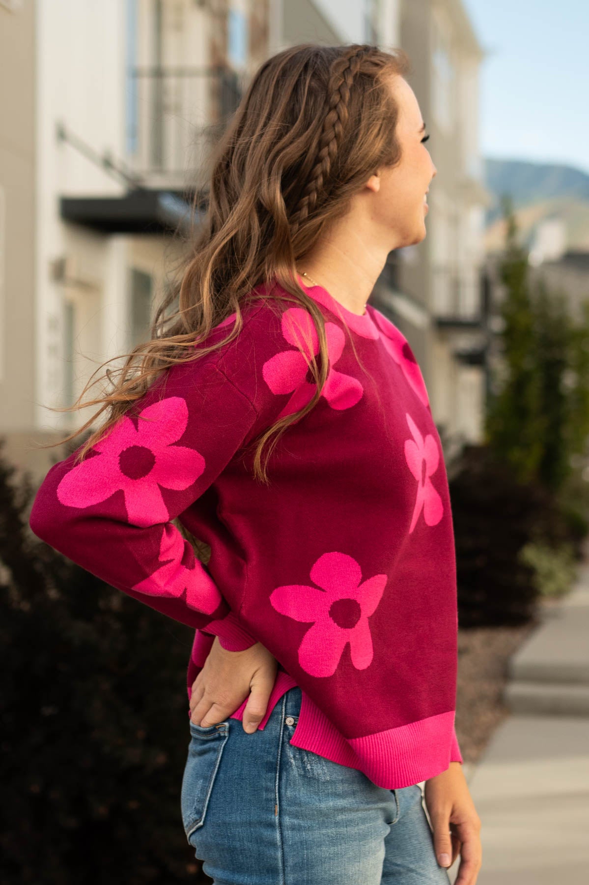 Side view of a raspberry sweater