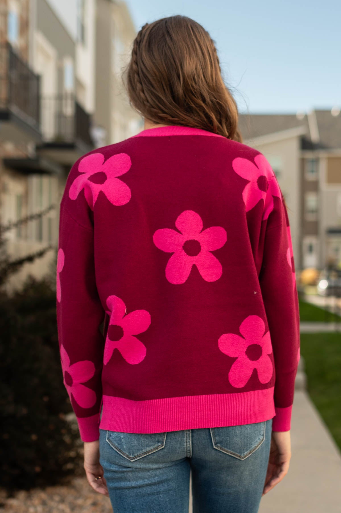 Back view of a raspberry sweater