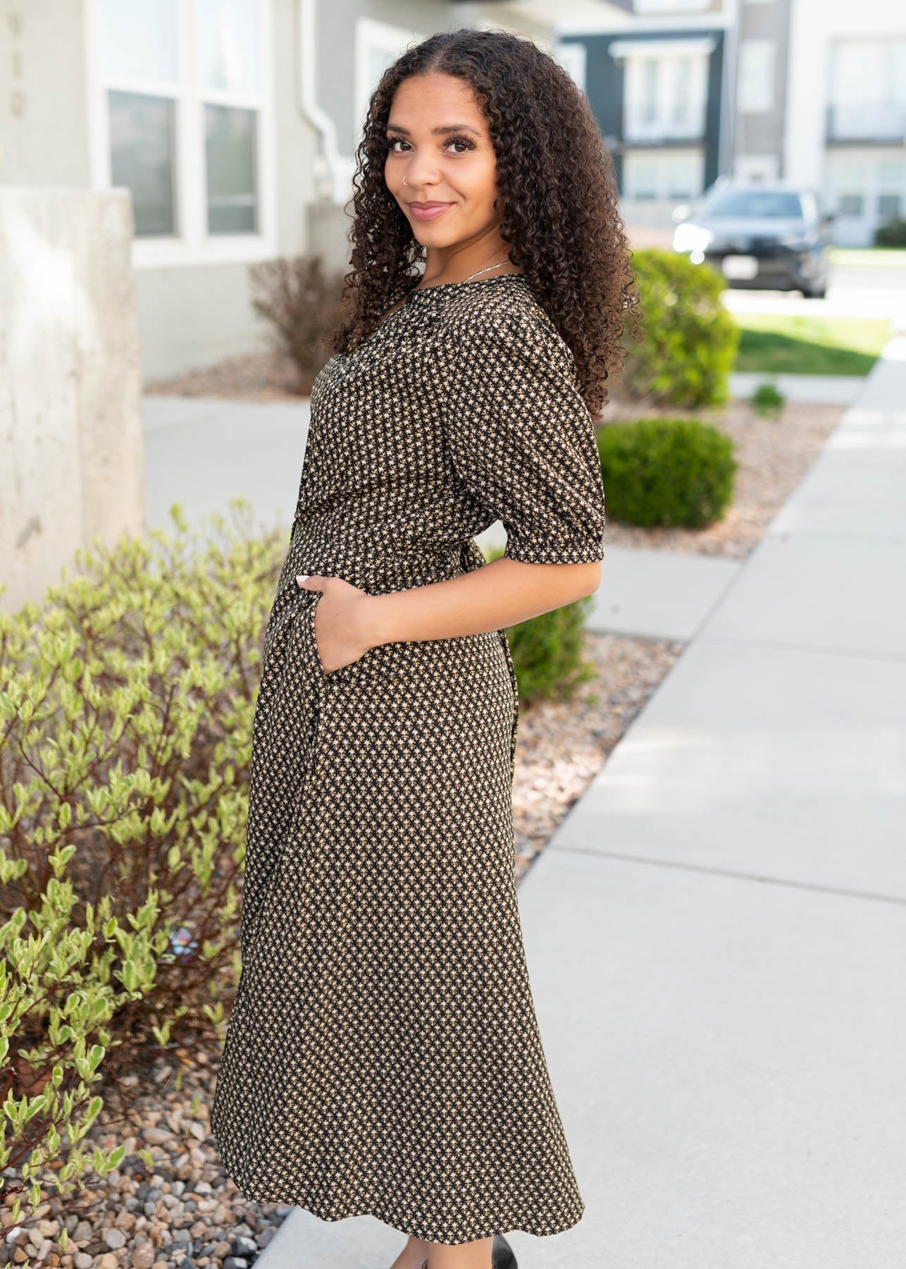 Side view of the black dress with pockets