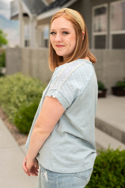 French blue top with lace on the sleeve